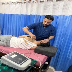 Physiotherapist providing rehabilitation treatment to patient in Jaipur Center